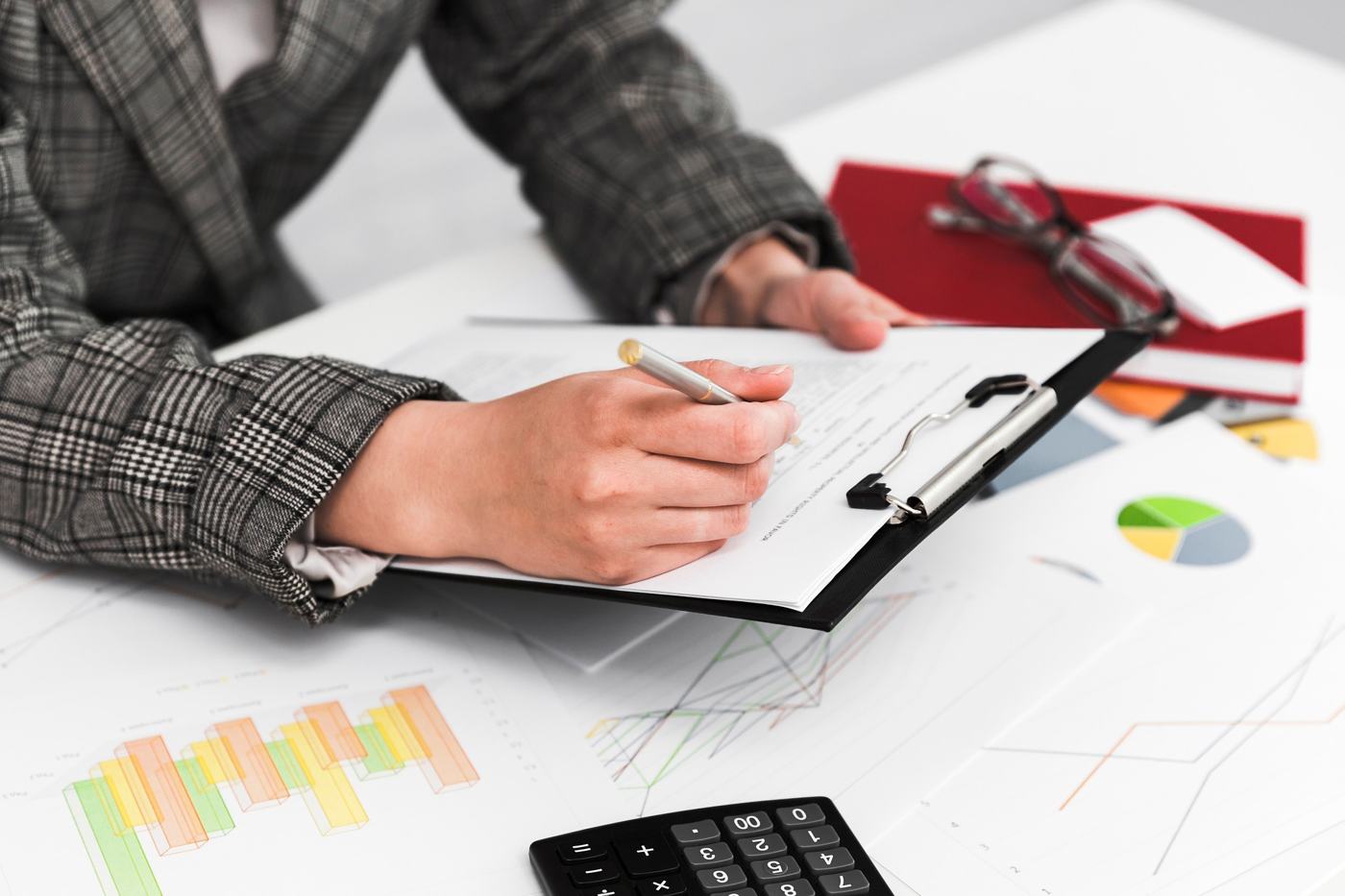 Reviewing policy documents and reports at a desk