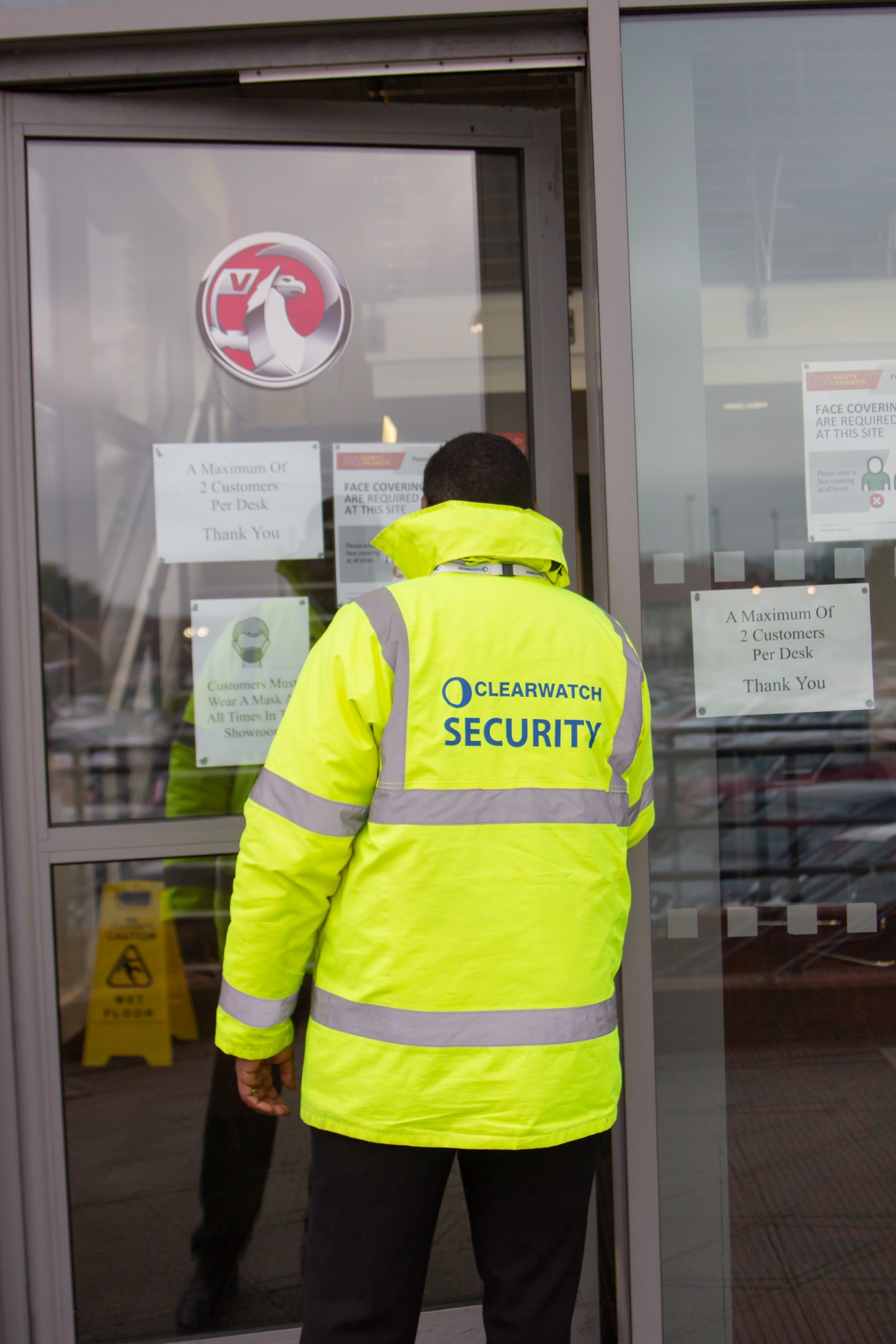 Clear Watch Security officer attending a commercial entrance